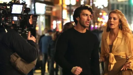 A camera operator films Justin baldoni and Blake Lively on the set of It Ends With Us - the two appear to be arguing.