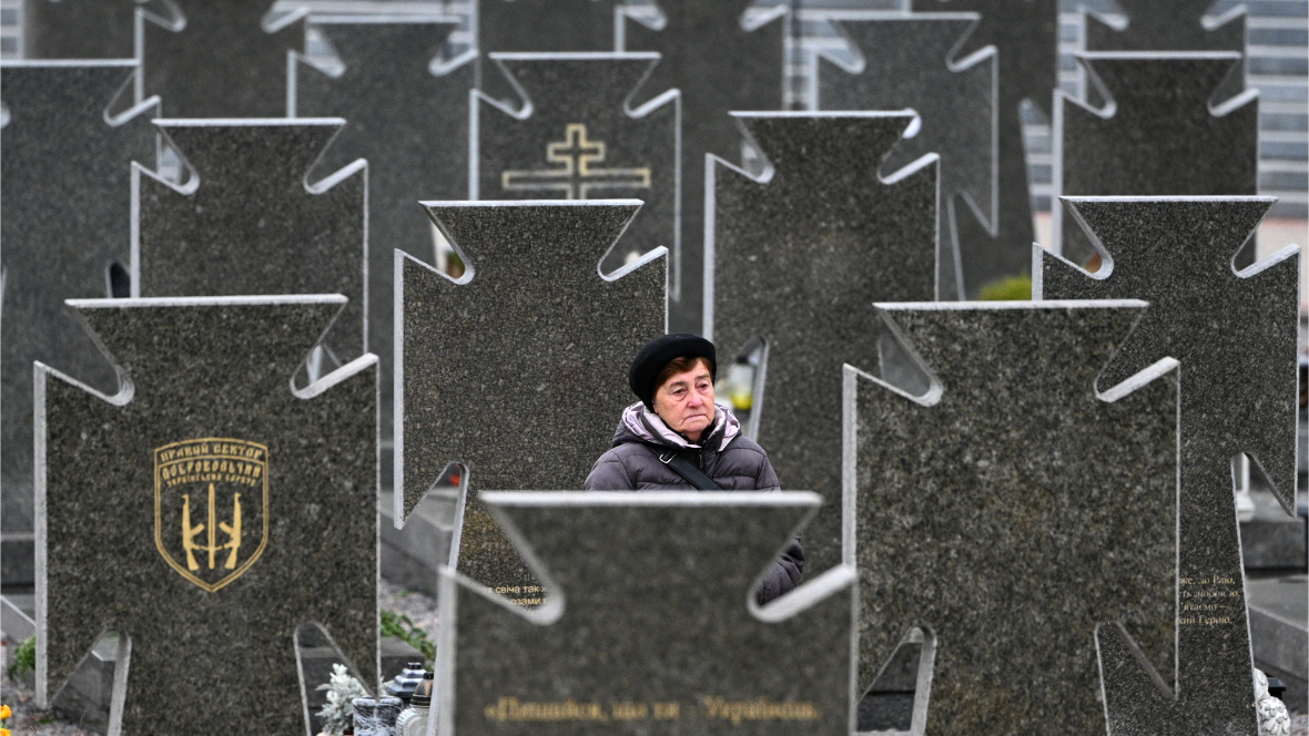 A woman visits graves of fallen Ukrainian soldiers at the Lychakiv cemetery.